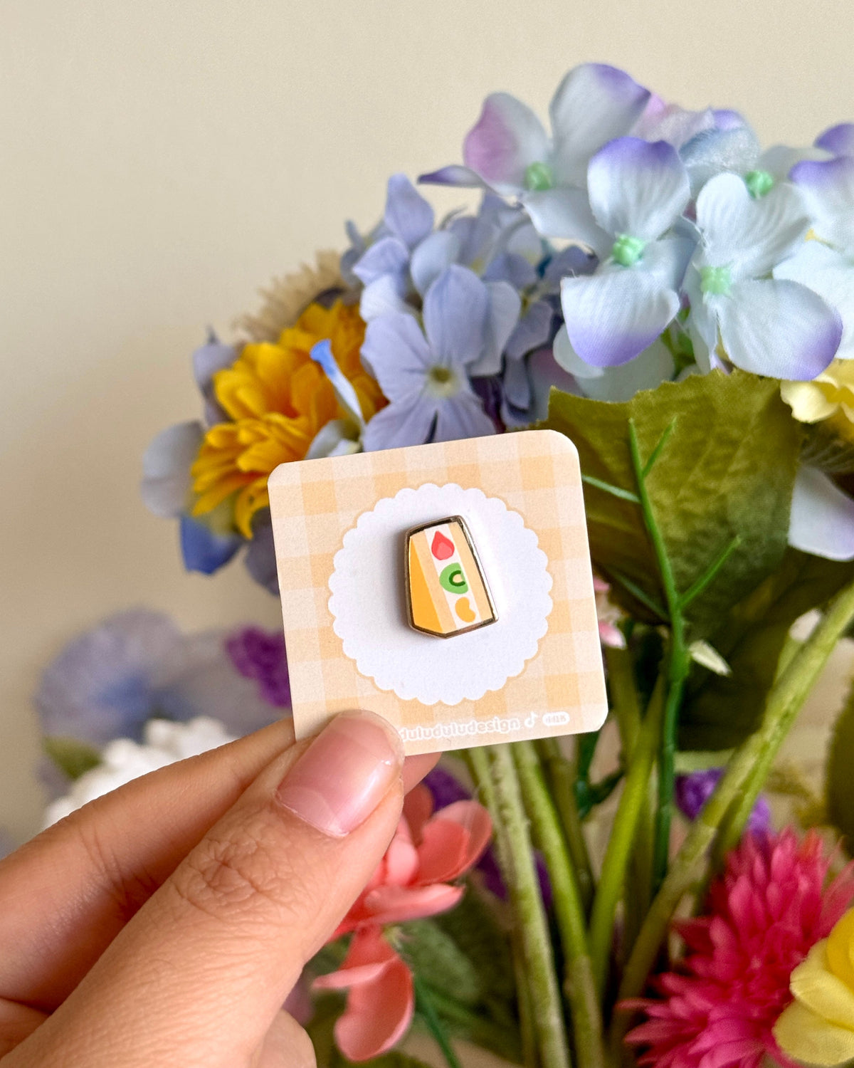 hand holding Japanese fruit sandwich mini enamel pin