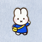 mini blue miffy pin on a plain background