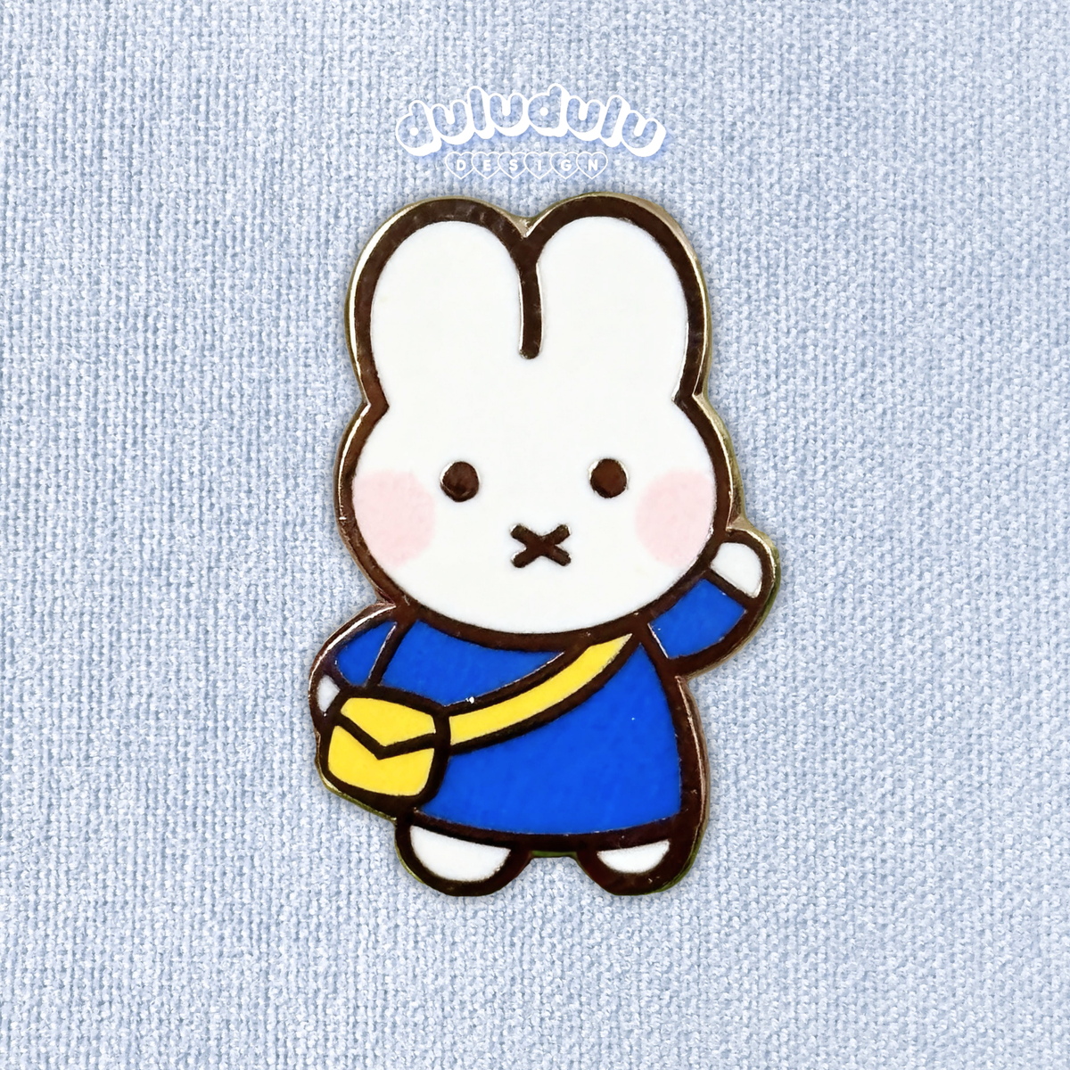 mini blue miffy pin on a plain background