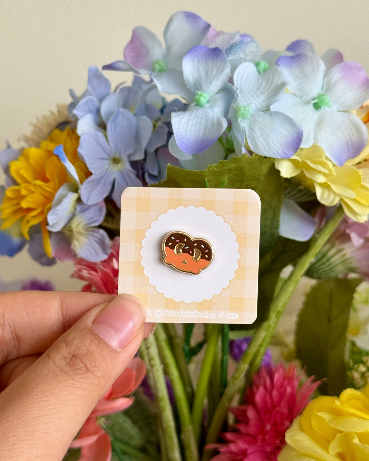 hand holding choco pretzel mini pin