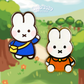 two miffy character enamel pins side by side, one in blue shirt and the other in orange shirt