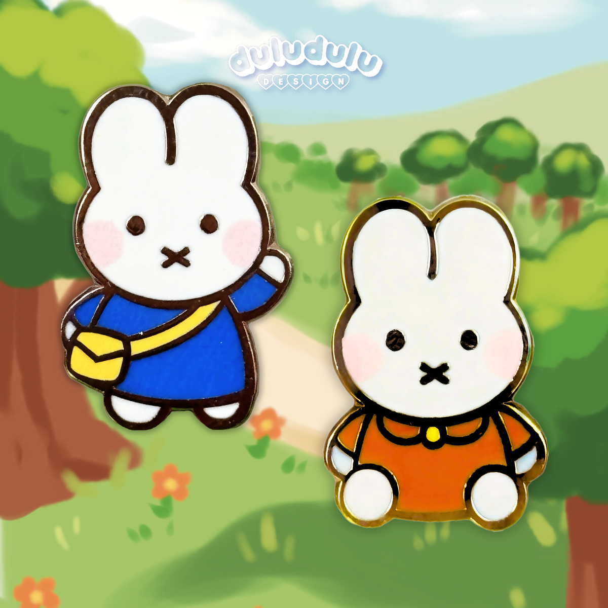 two miffy character enamel pins side by side, one in blue shirt and the other in orange shirt