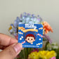 Hand holding poko mini pin under natural sunlight