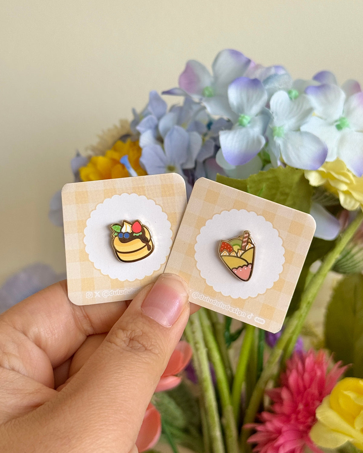 hand holding pancake and crepe mini pins