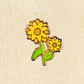A yellow sunflower enamel pin with green leaves.